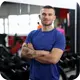 Vinicius, personal trainer e aluno do Curso Córtex, sorrindo em seu depoimento sobre neurociência e mudança de hábitos.